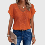 Blusa con detalle de encaje y corte holgado de verano
