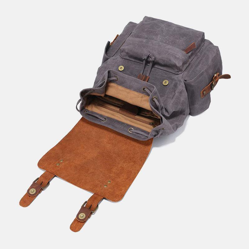 Laptopryggsäck i canvas och konstläder med vadderat fack