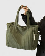 Strukturerad totebag med snördetalj och yttre fickor