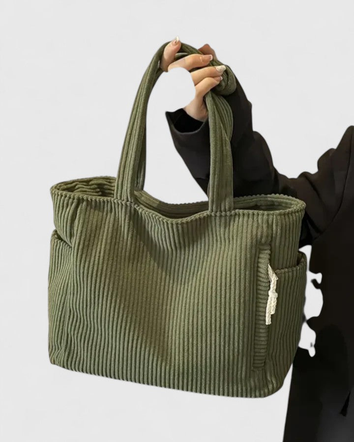 Strukturerad totebag med snördetalj och yttre fickor