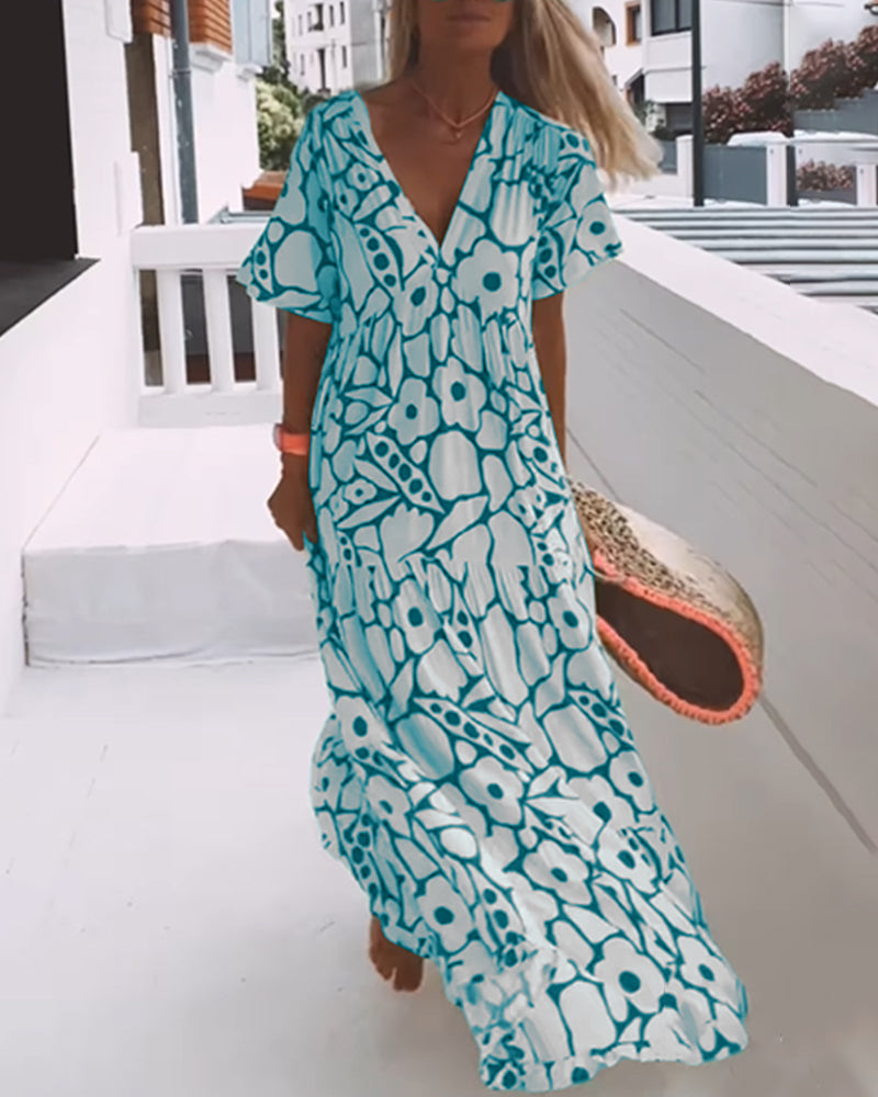 Vestido estampado con cuello de pico, media manga y detalle de pliegues