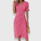 Vestido floral con mangas abullonadas y detalle romántico