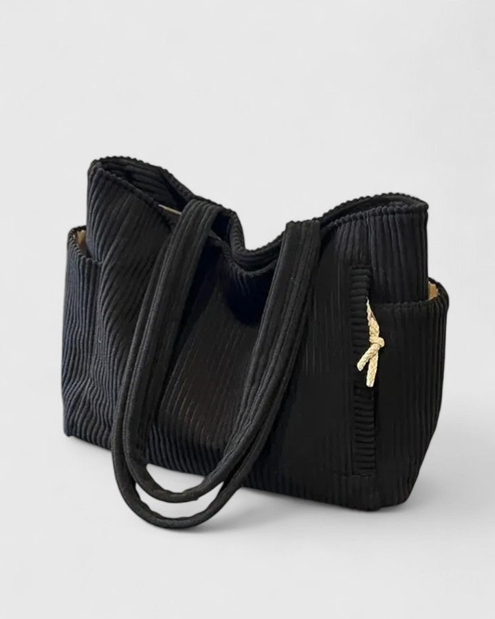 Strukturerad totebag med snördetalj och yttre fickor