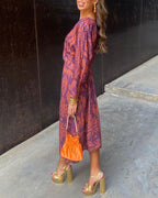 Vestido largo estampado con escote de pico y manga larga