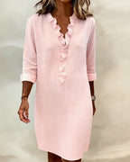 Vestido de algodón y lino con cuello de pico y detalle de volantes