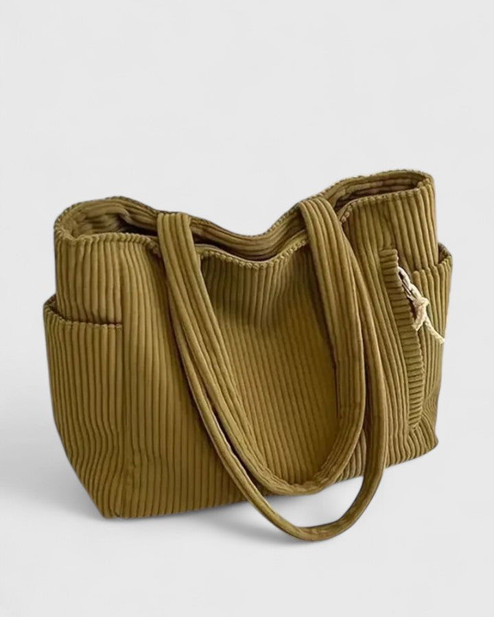 Strukturerad totebag med snördetalj och yttre fickor