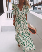 Vestido estampado con cuello de pico, media manga y detalle de pliegues