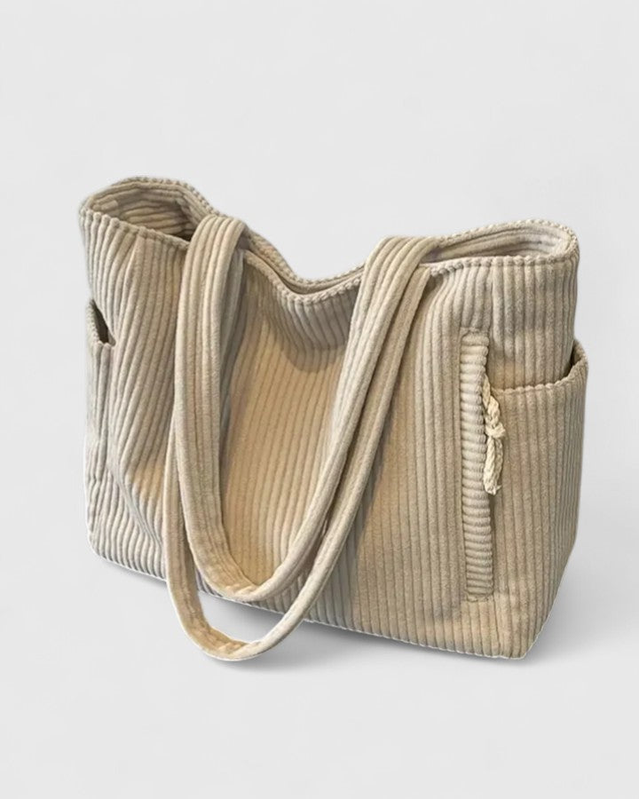 Strukturerad totebag med snördetalj och yttre fickor
