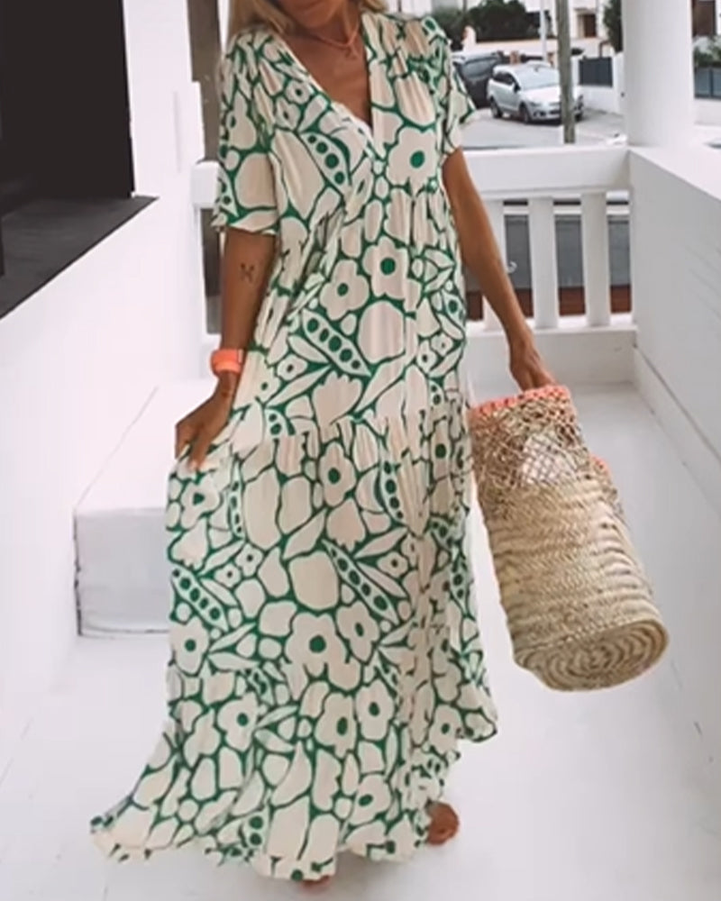 Vestido estampado con cuello de pico, media manga y detalle de pliegues