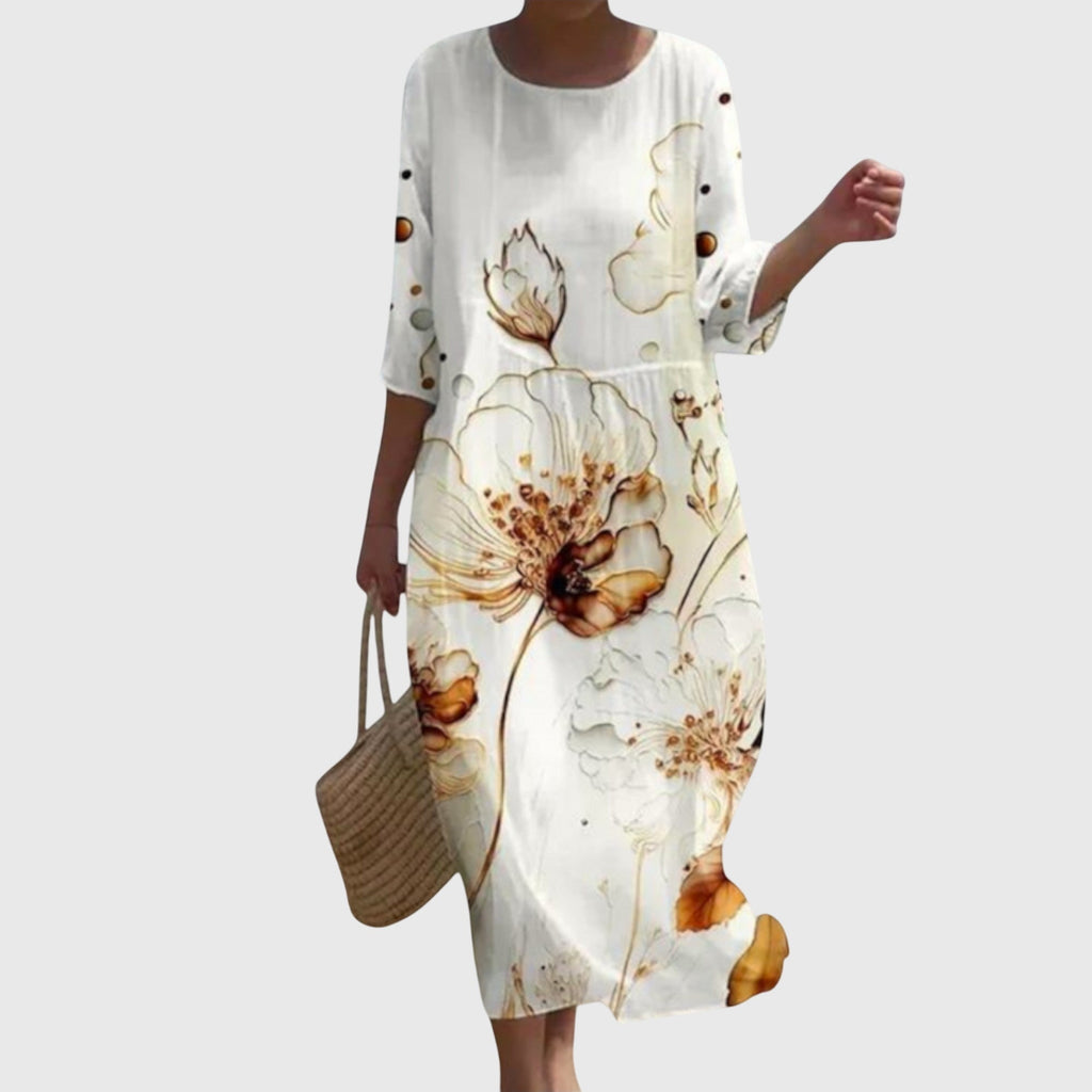 Blommig maxiklänning med flytande, feminin design