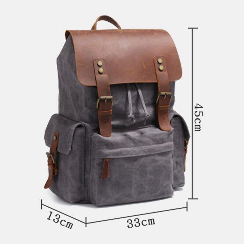 Laptopryggsäck i canvas och konstläder med vadderat fack