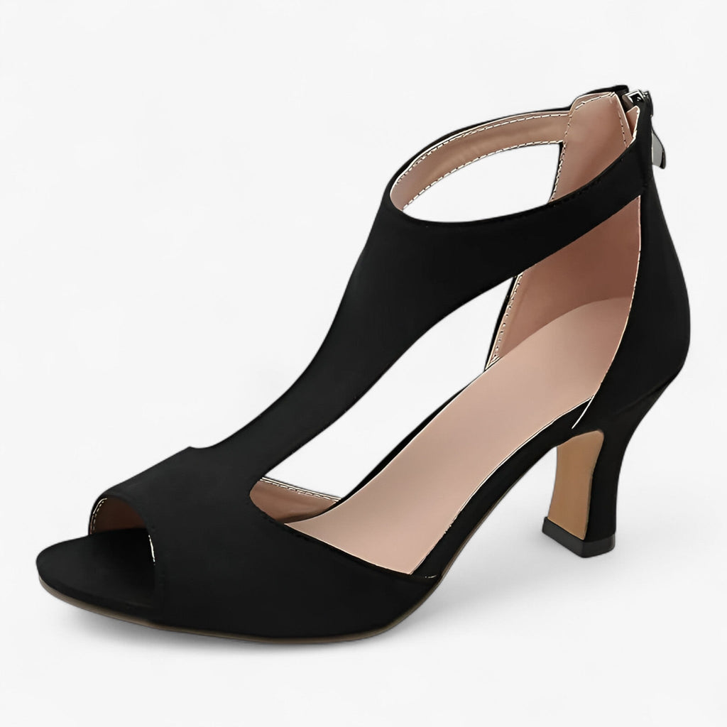 Pumps i konstläder med fisknätsdesign och öppen tå
