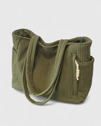 Strukturerad totebag med snördetalj och yttre fickor