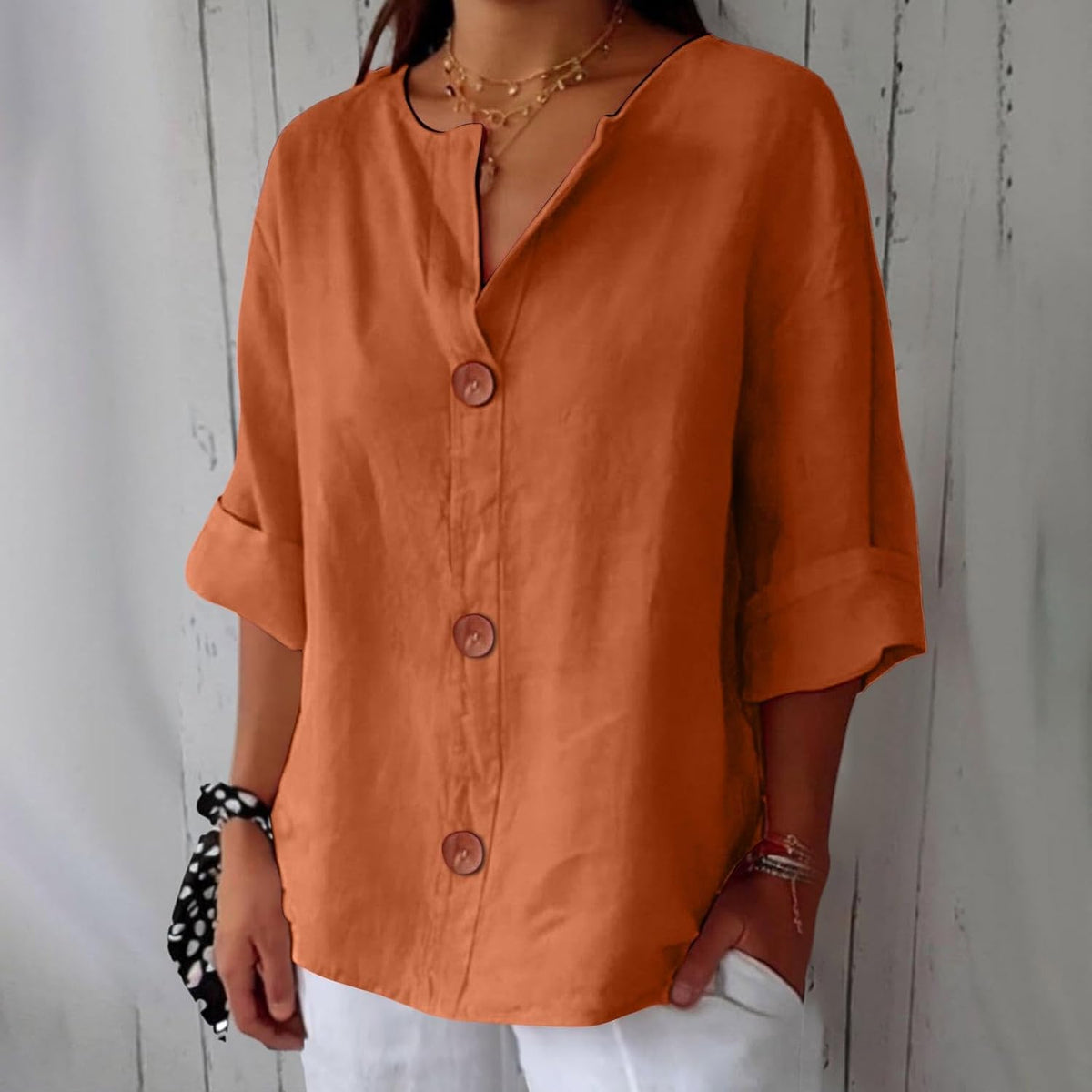 Blusa ligera de aspecto lino con bajo corto