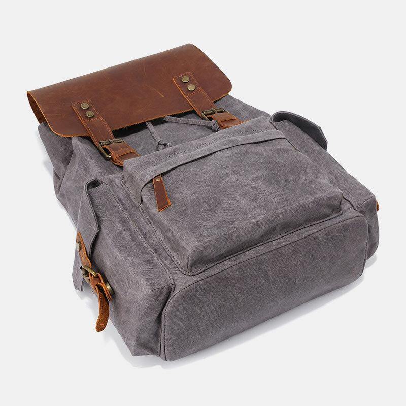 Laptopryggsäck i canvas och konstläder med vadderat fack