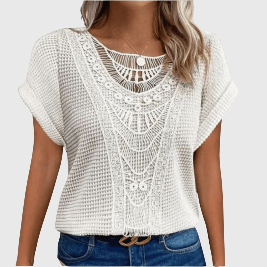 Blusa con detalle de encaje y corte holgado de verano