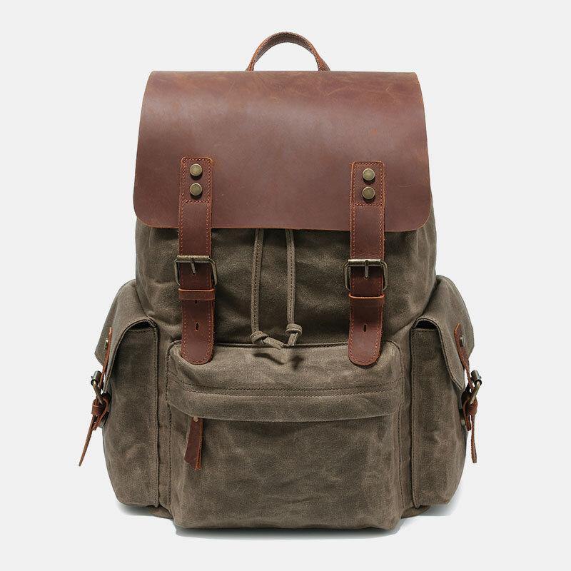 Laptopryggsäck i canvas och konstläder med vadderat fack