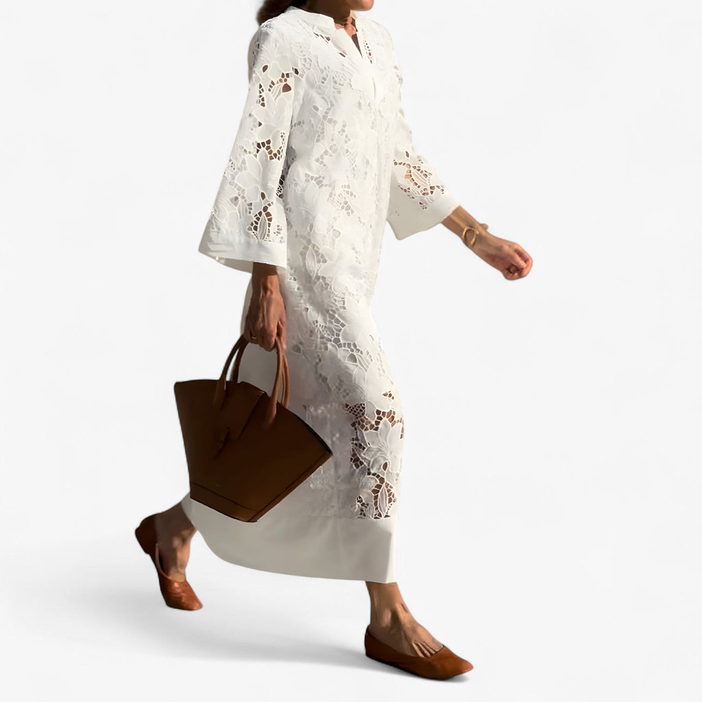 Vestido midi de encaje floral con mangas transparentes y cintura ajustada