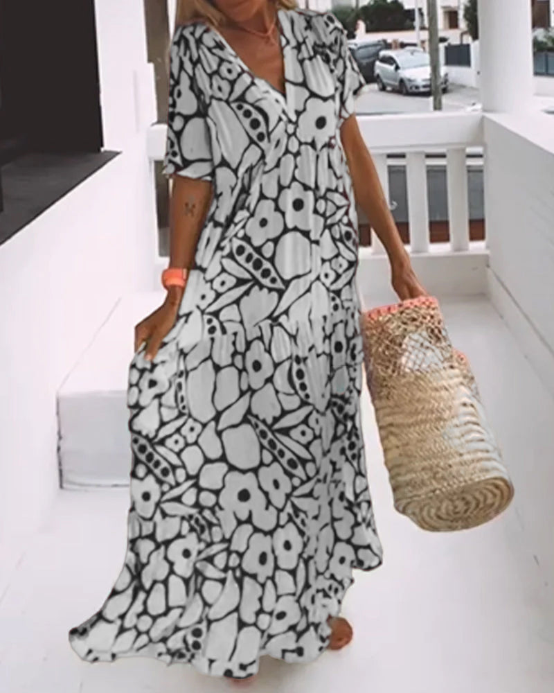 Vestido estampado con cuello de pico, media manga y detalle de pliegues