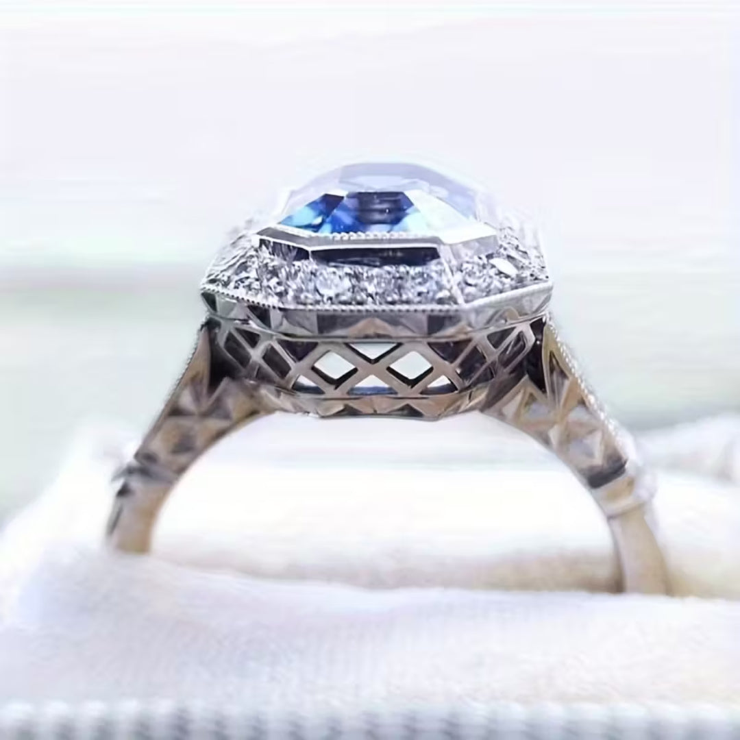 Blue Stone Crown Ring with Vintage-Style Setting and Regal Shape