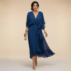Flowing V-neck dress with soft draping detail