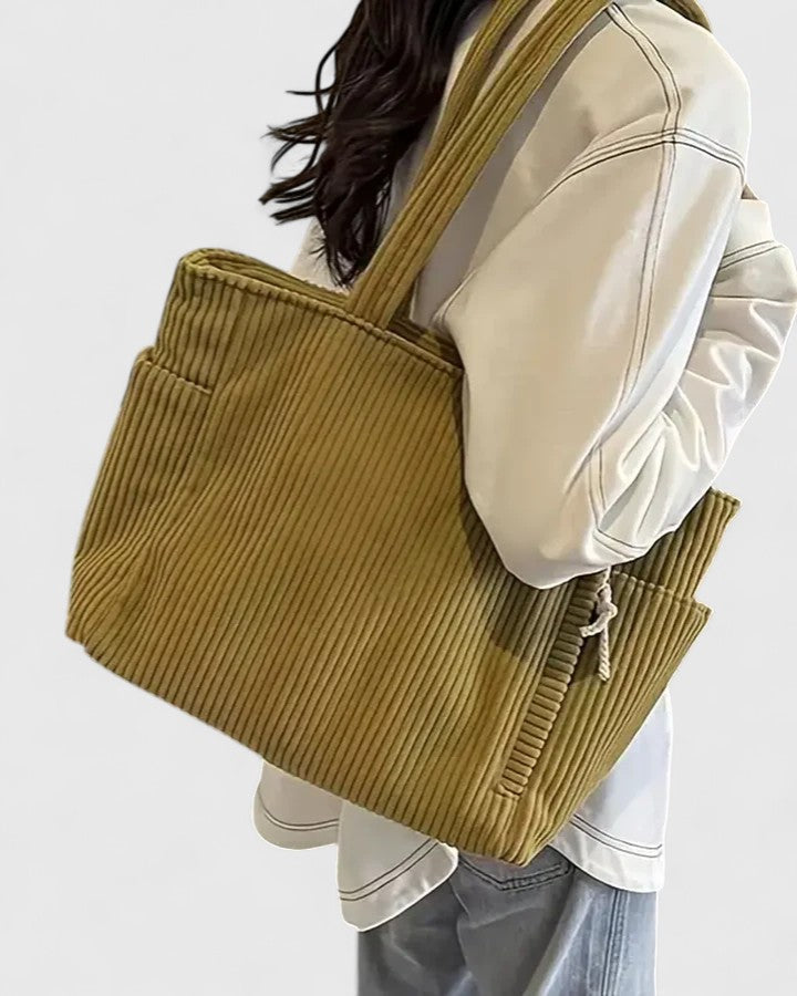 Strukturerad totebag med snördetalj och yttre fickor