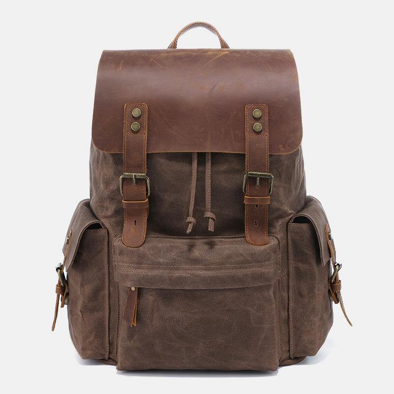 Laptopryggsäck i canvas och konstläder med vadderat fack