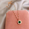 Clock Pendant Necklace with Green Stone in Gold Colour