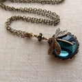 Vintage-Style Dragonfly on Blue Glass Orb Pendant with Soft Glow