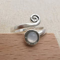Spiral Ring with Round Milky Stone in Silver Colour