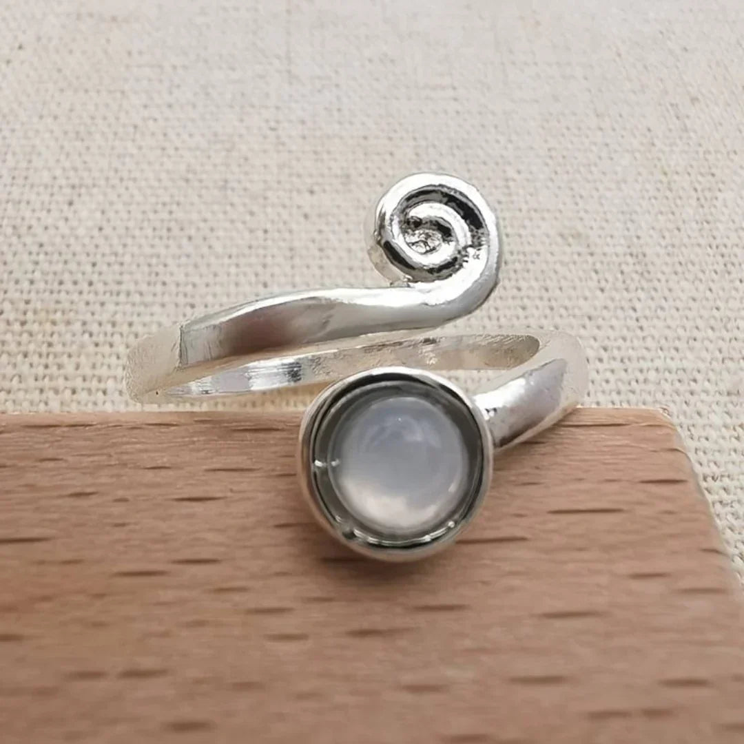 Spiral Ring with Round Milky Stone in Silver Colour