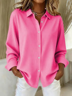 Elegant blus i klar färgskala