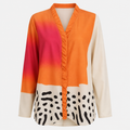 V-ringad blus i colour block med knäppning fram