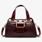 Bolso de dos compartimentos con estampado de cocodrilo y correa ajustable