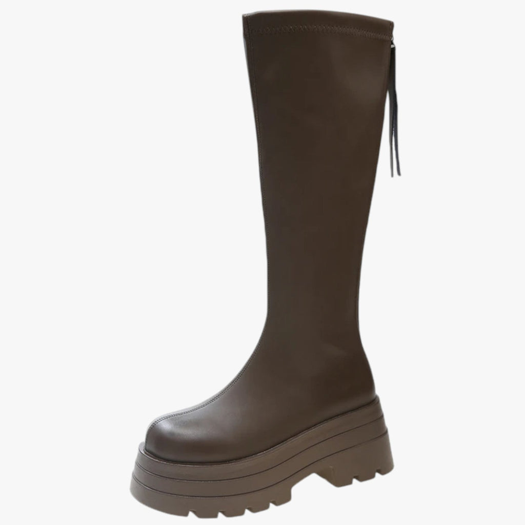 Lårhöga boots med dragkedja på sidan och grov sula