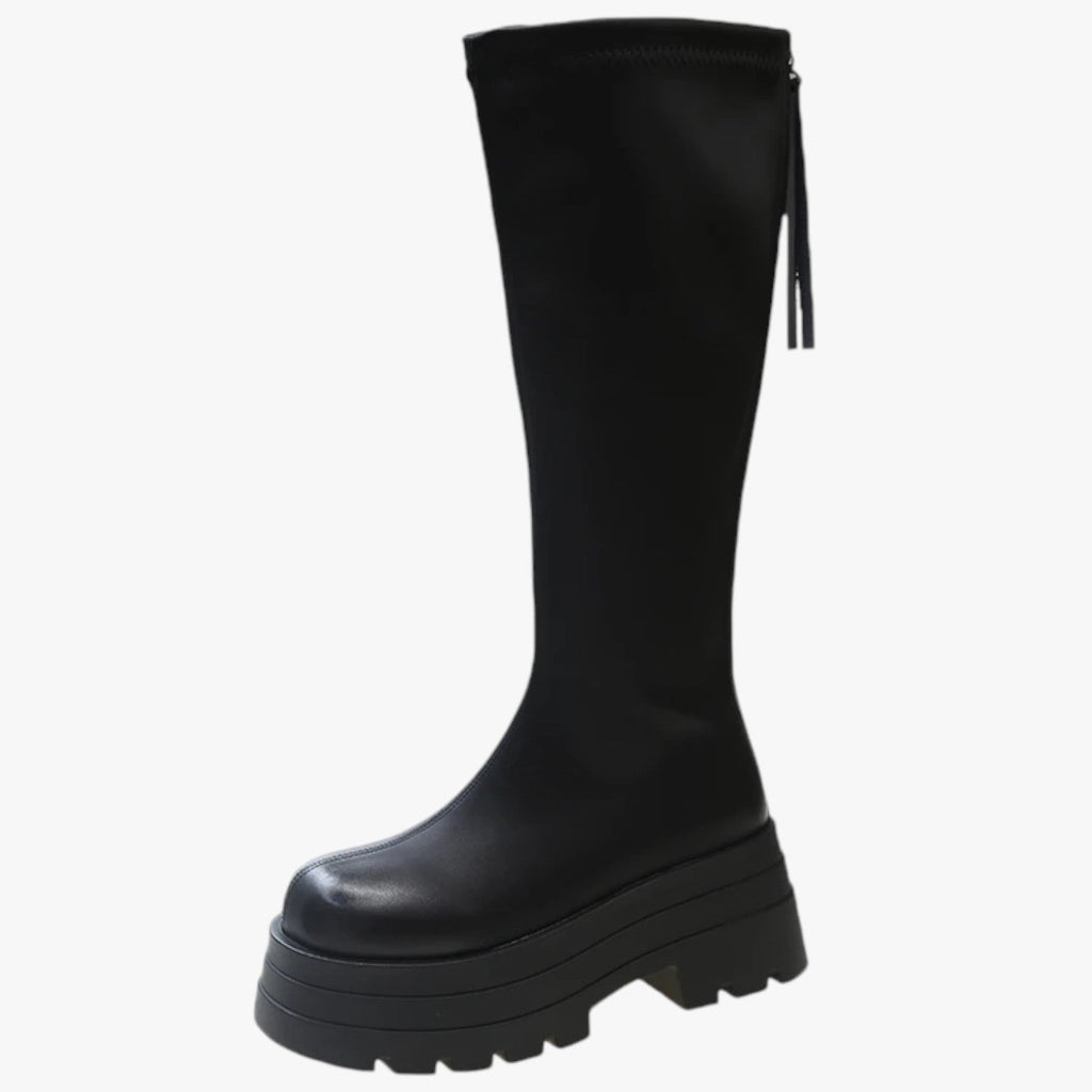 Lårhöga boots med dragkedja på sidan och grov sula