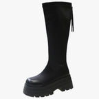 Lårhöga boots med dragkedja på sidan och grov sula