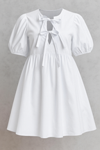 Vestido de manga abullonada con un delicado detalle de lazo delantero
