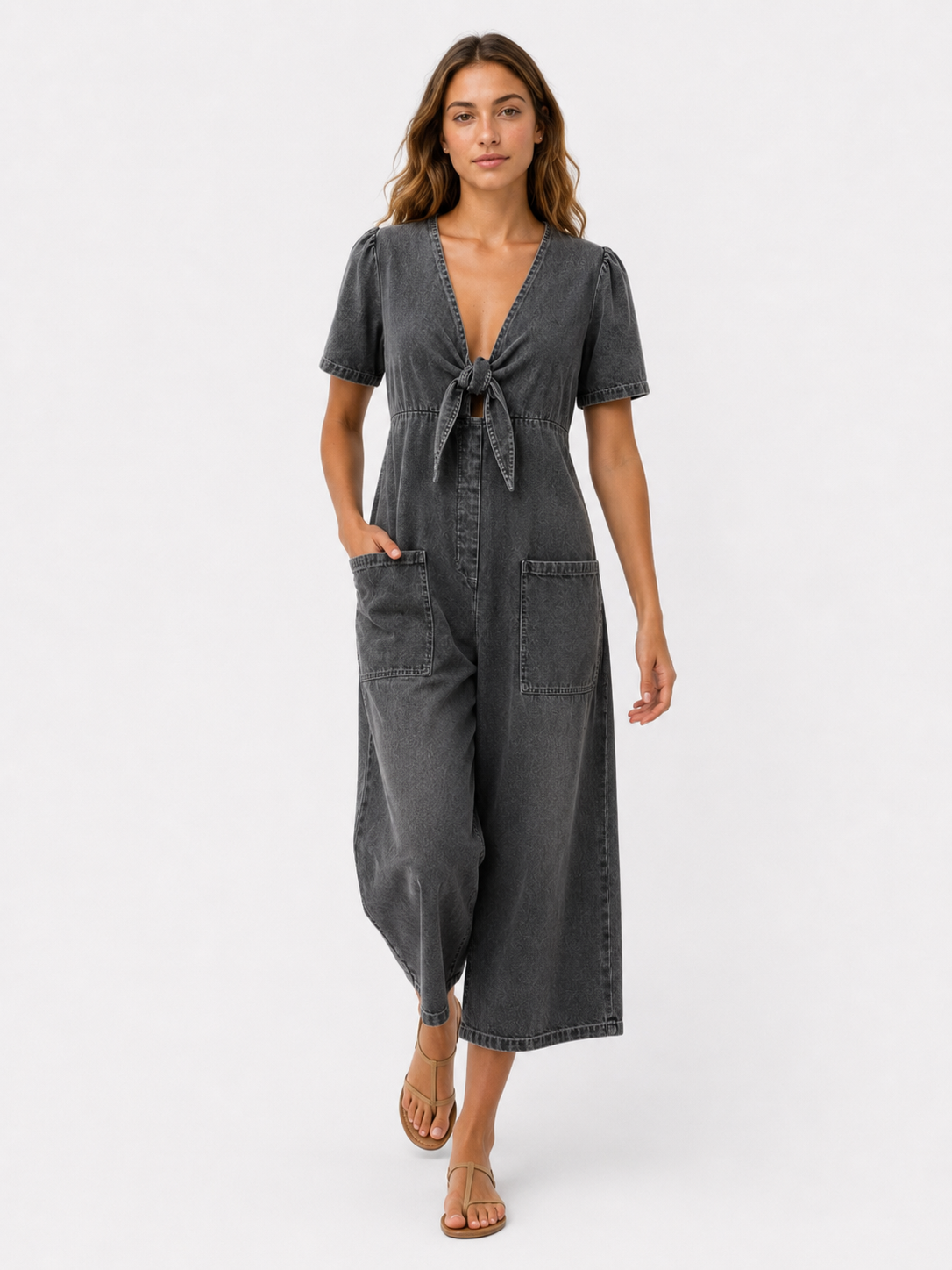 V-neck jumpsuit with a front tie and front pockets