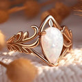 Iridescent White Stone Drop Ring in Gold Colour with Graceful Shape