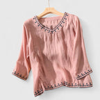 Blusa bordada con cuello de pico y corte holgado