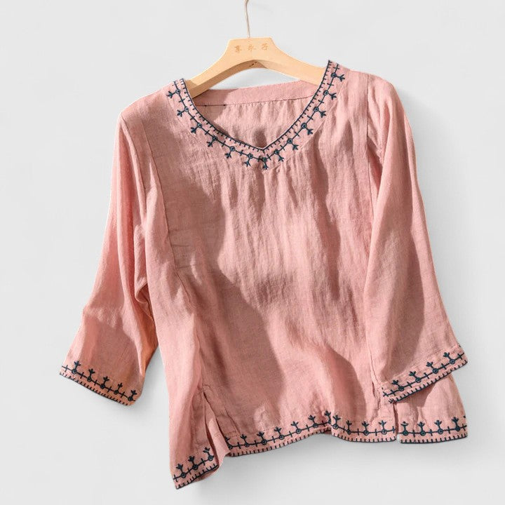 Blusa bordada con cuello de pico y corte holgado