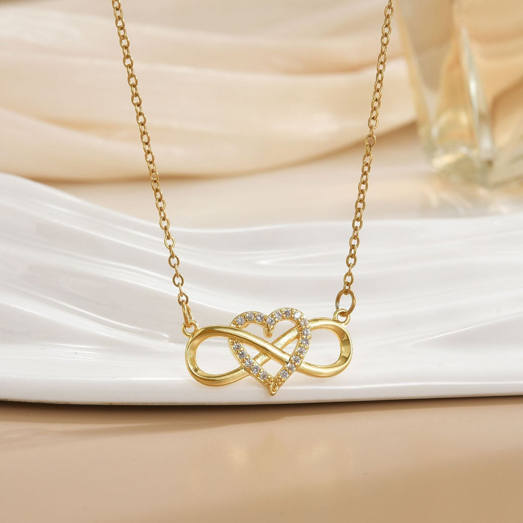 Halsband med kärleksknut i oändlighetsform i guldfärg