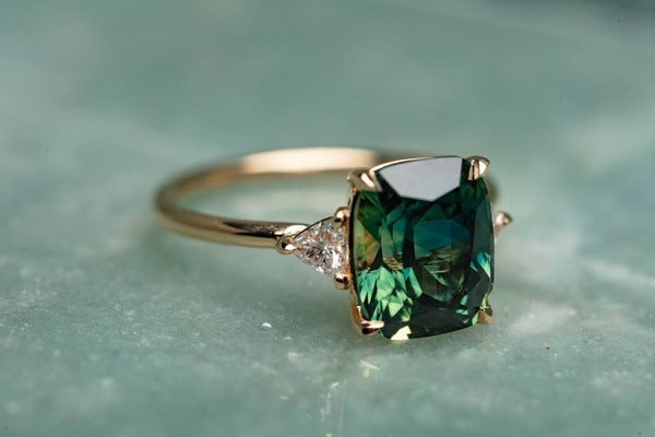 Green Stone Solitaire Ring with Sparkling Side Accents
