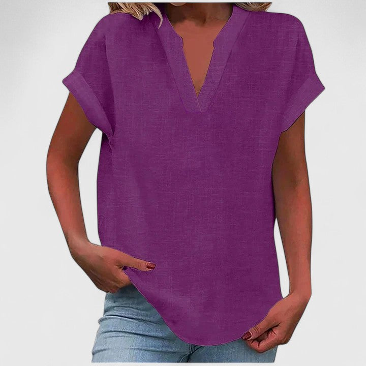Blus med naggad halsringning, korta ärmar och avslappnad skärning