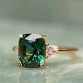 Green Stone Solitaire Ring with Sparkling Side Accents