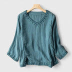 Blusa bordada con cuello de pico y corte holgado