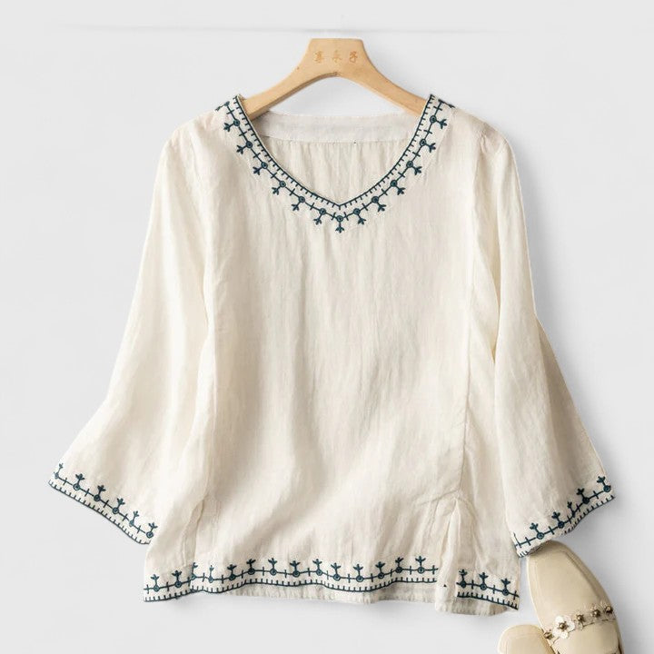 Blusa bordada con cuello de pico y corte holgado