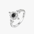 Silver-Tone Ring with Black Stone and Knot Design