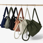 Bolso acolchado tipo puffer con correa de hombro ajustable